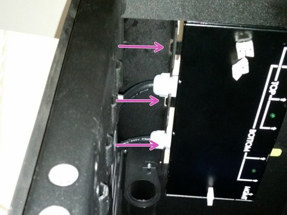 Align the three DC PDU tabs with the slots on the roof of the rack.