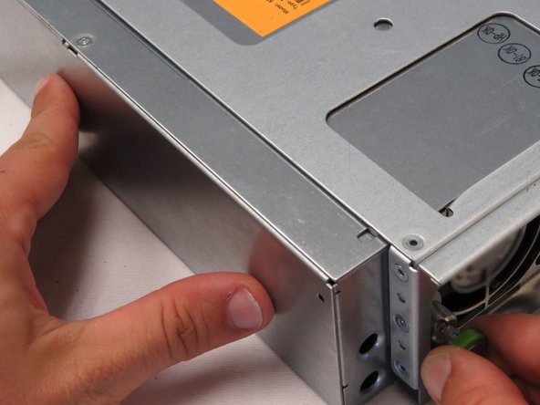 Push the new PSU in towards the chassis, as shown.