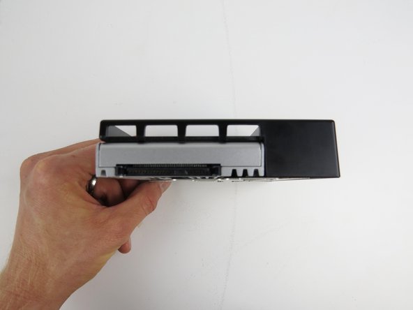 Once installed, the SSD connector should be facing outward as shown.