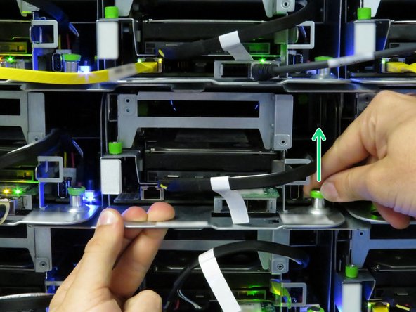 Grasp the server as shown.