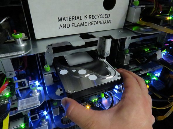 Insert the HDD, as shown.