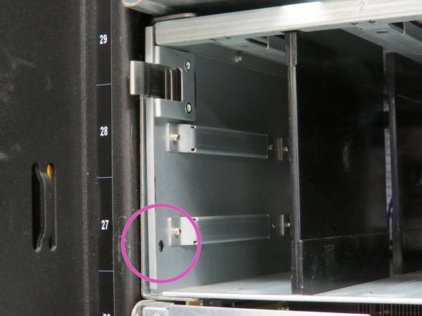 Screw in the two safety screws that were previously removed.