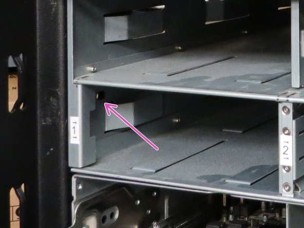 Secure the chassis by installing the (2) screws that were previously removed.