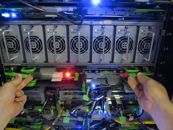 Push the storage tray back into the Open Vault chassis.