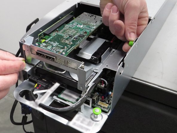 Unscrew the two thumbscrews.