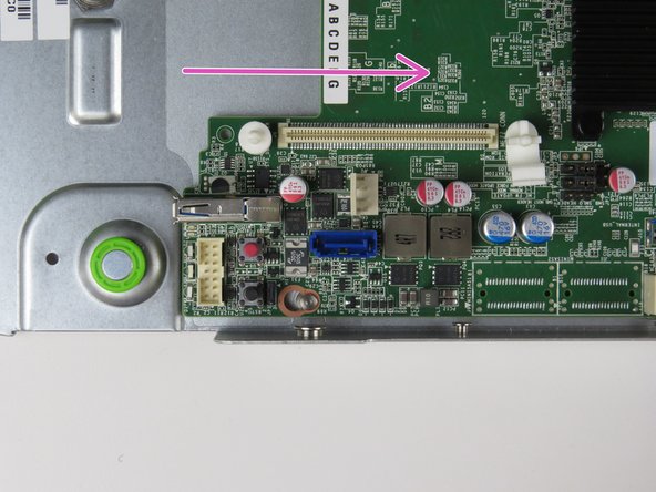 Slide the motherboard toward the rear of the chassis until resistance is felt.