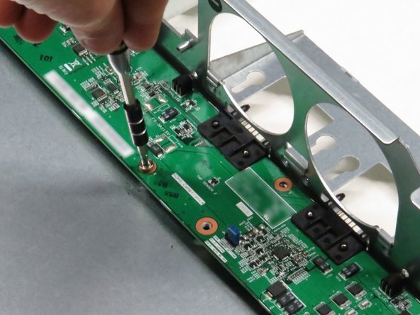 Install the eight Phillips #2 screws.