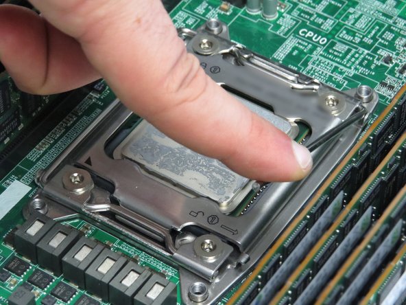 The retention lever is spring loaded. Apply force to the lever as it rises.