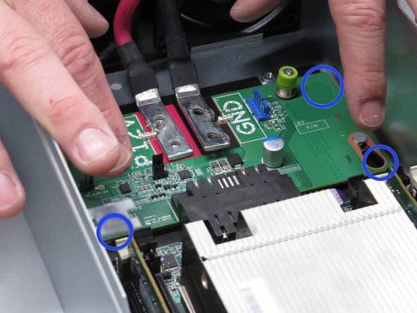 Touch the midplane board as shown.