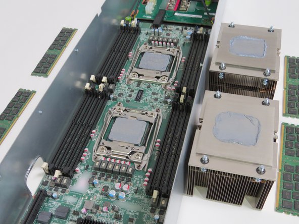 Place each DIMM next to their respective socket, as shown.