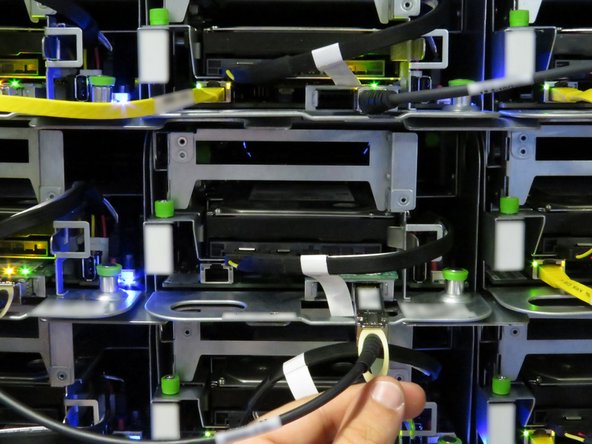 Use the pull-tab to disconnect the cable.