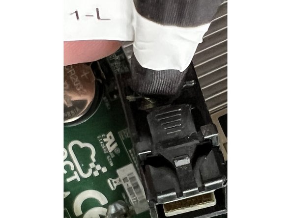 Each connector has a push tab.  Depress the push tab to release