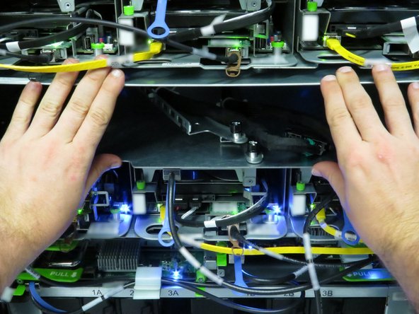 Slide the chassis into the Open Rack.