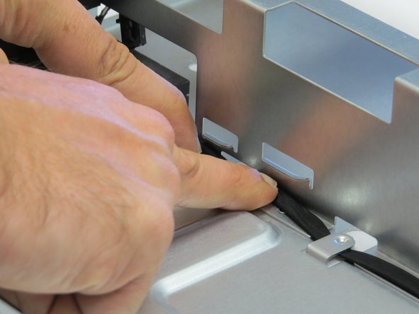 Slide the LED cable away each cable management tab in the chassis.