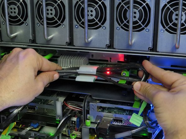 Secure the SAS cable in the nylon cable management clip.