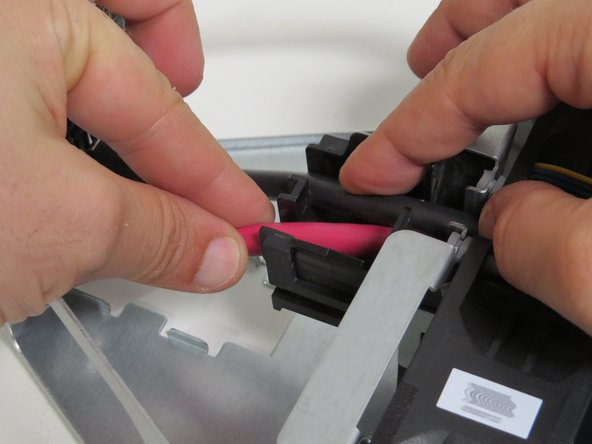 Seat the bus leads into their respective slots near the fans.