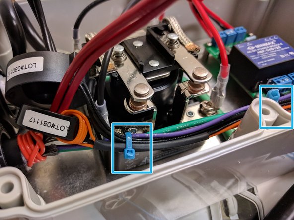 Organize the low voltage wires (EV Ground, EV Pilot, GFCI coil lead, Current coil lead and the relay  coil) and secure with a tie wraps with light tension. Tuck the wires down to the bottom of the enclosure.