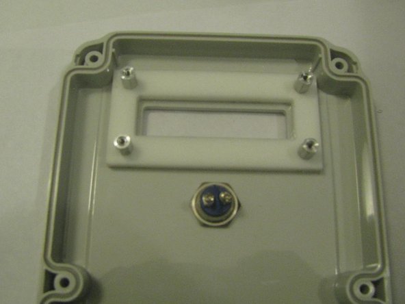 Identify the four 1/2" wide-head screws. They fit the threaded metal spacers. Identify the four foam plastic washers.