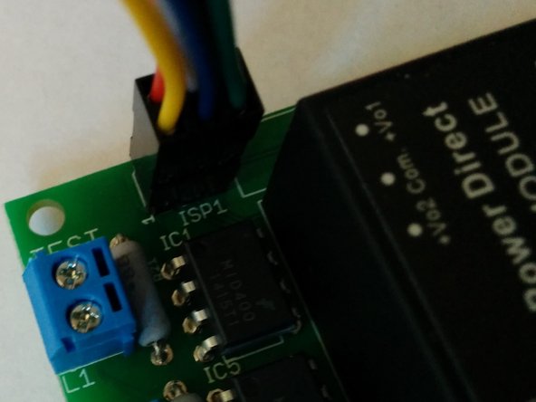 The red stripe on the ribbon cable or yellow wire on the 6 pin connector aligns with pin 1 of the ISP connector.