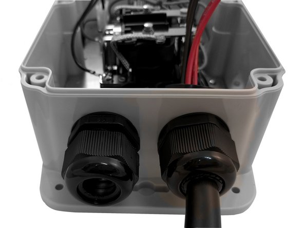 Insert EV Cable through the Cable Gland on the right and tighten.