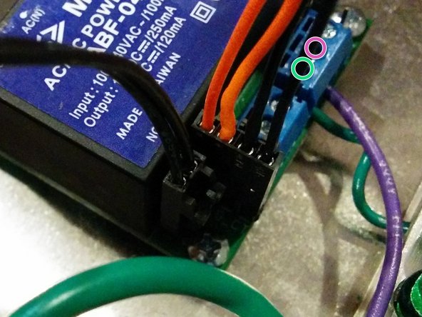 Connect the 4-pin GFCI CT connector to the OpenEVSE board. This coil has two black wires and two orange self-test wires looped through the coil with a 4 pin connector. Orange Self test wires positioned to the inside Black GFCI CT wires to the outside.