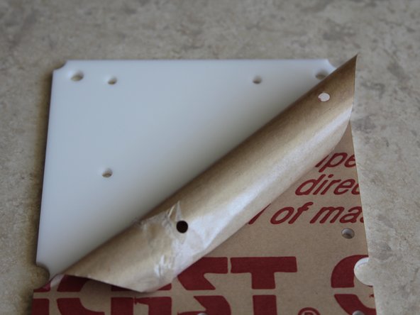 Peel protective coating from the mounting plate.