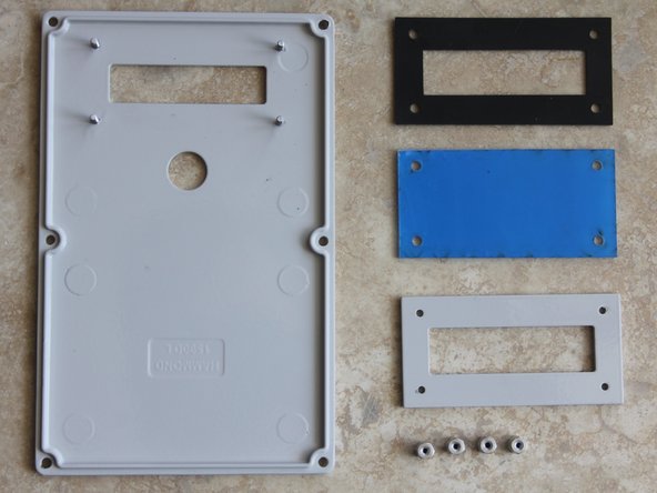 Place Enclosure lid on a soft surface, use care not to damage or scratch the enclosure finish. Remove HEX standoffs from the lid.