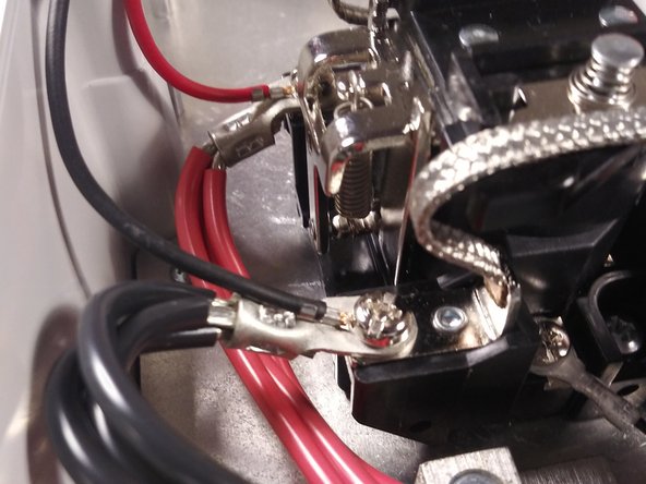 Screw the ring terminal on the EV cable power conductor to the top position of relay along with the red wire on the wiring harness.