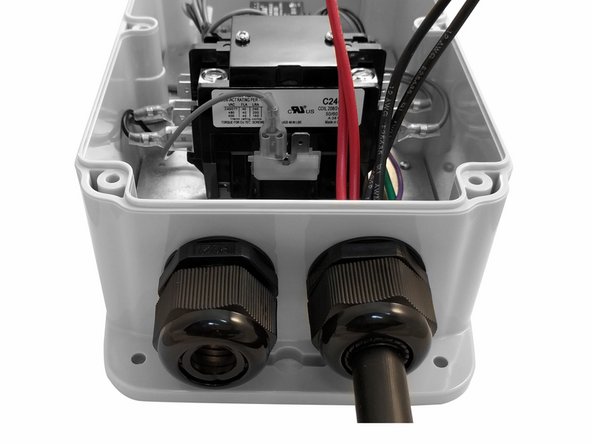 Insert EV Cable through the Cable Gland on the right and tighten.