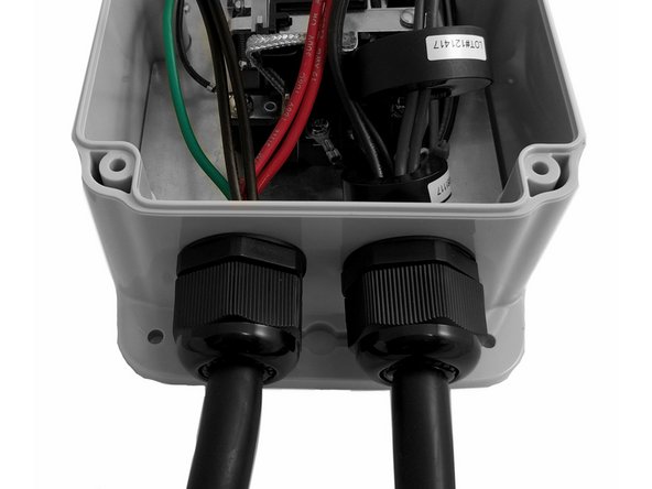 Insert Input cable through the cable gland on the Left and tighten. This step will use the same relay screws left loose from an earlier step.