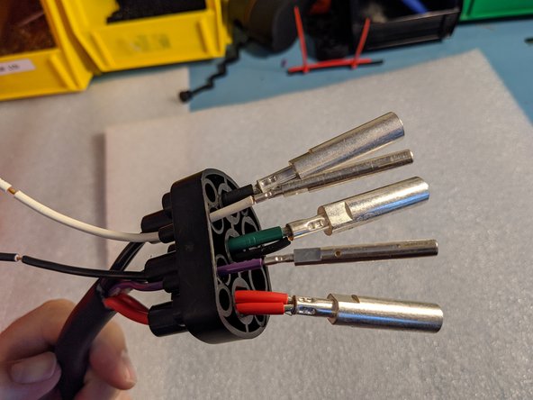 Insert the signal pin on the PURPLE wire and crimp.
