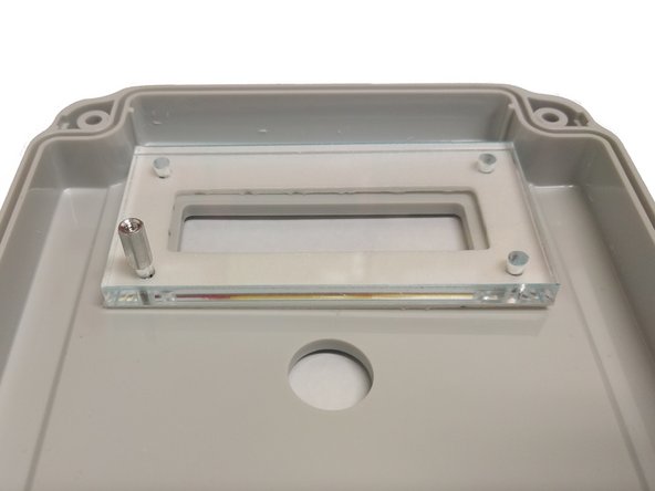 Remove any protective film from the clear window.