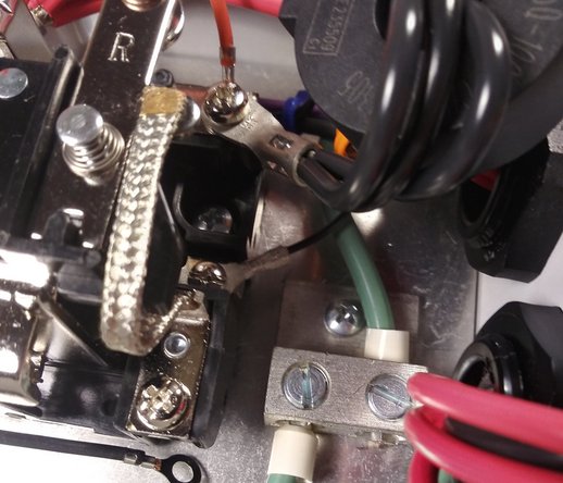 Insert the input cable through the left gland.