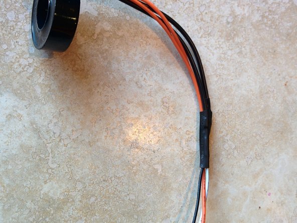 Secure with shrink wrap tubing as close to the GFCI coil as possible.