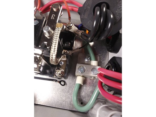 Insert the input cable through the left gland.