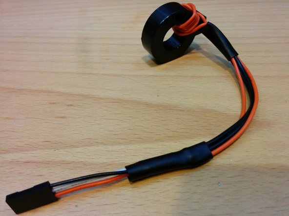 Shrink a large piece of shrink tubing over the connections to finish your GFCI coil with self test.