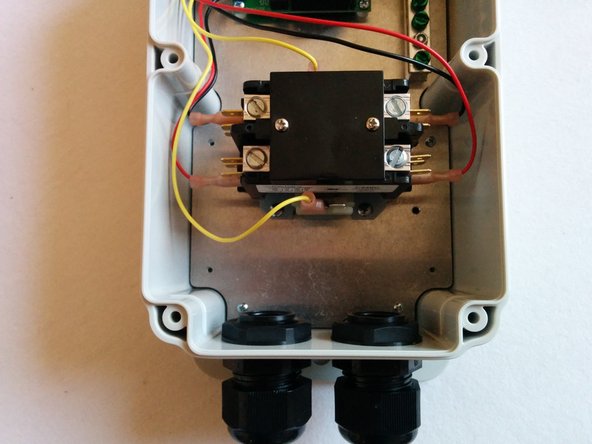 Install Cable glands on the enclosure. If using a large gland for the input cable, use a step drill to enlarge the hole. (Left as built in this guide)
