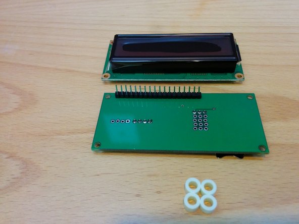 Place nylon spacers on each corner of the logic board.