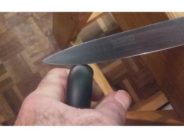 Bend the cable into a small-radius loop, then cut into the outside of the loop with a sharp knife. The cut should propagate into the insulation, allowing it to be pulled apart by hand, Repeat on all sides of the cable. Try not to cut the inner insulation