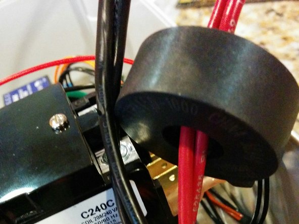 Thread one AC line (either side Hot1 or side Hot2) through the current-measurement CT (2-pin OpenEVSE Current CT) .       If you are using the OpenEVSE 40A J1772 Cable, this is either the red pair OR the black pair of wires.