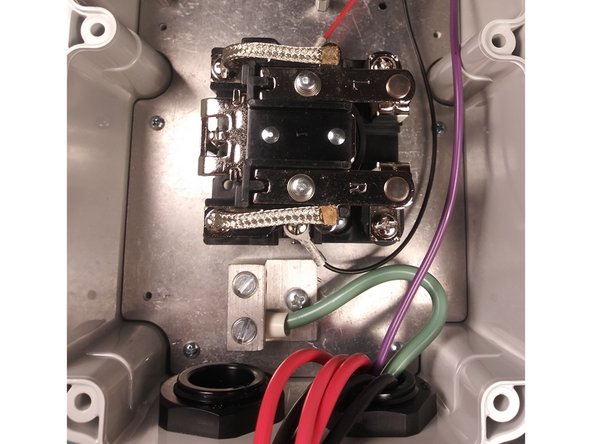 Insert EV Cable through the Cable Gland on the right and tighten.