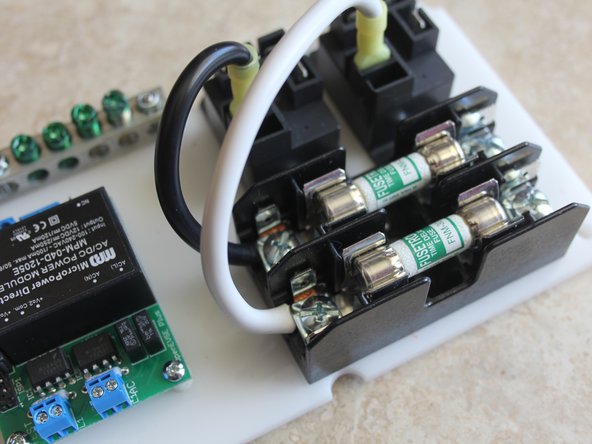Place nylon spacers between OpenEVSE board and mounting plate. Tighten Lock Nuts from the bottom. Do not over tighten.