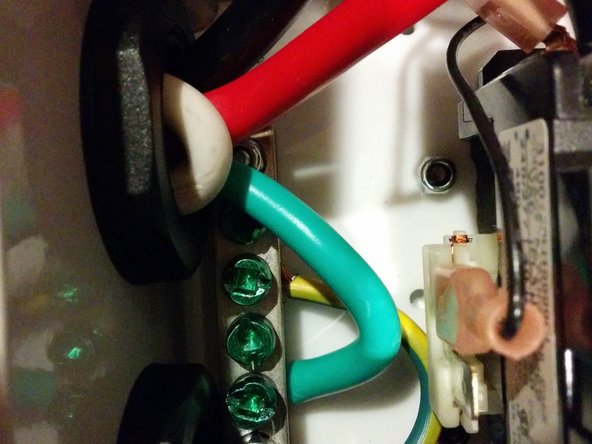 Connect the Ground from the J1772 cable to the ground block.