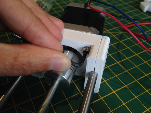 Use four M3 16mm screws to attach the stepper motor to the motor end.