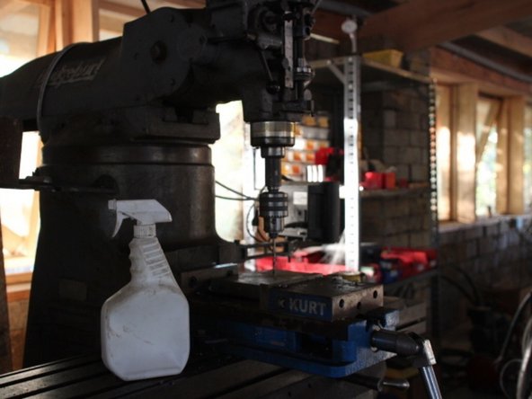 Make holes in the center of each 8&quot;x8&quot; plate big enough for 1&quot; bolts. We drilled starter holes and then used an acetylene torch to widen them.