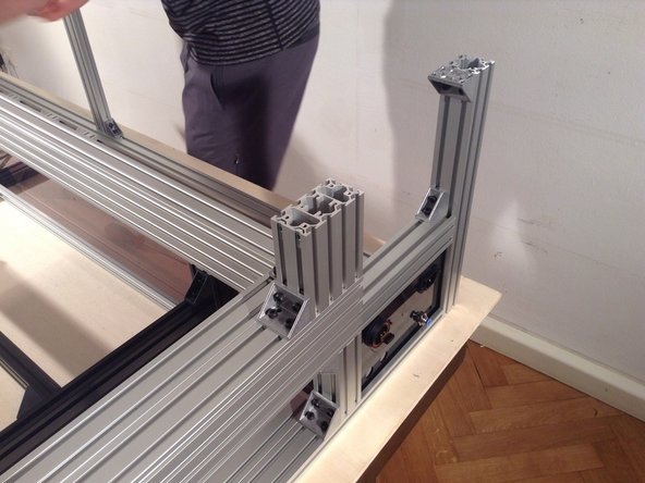 Mount double brackket on top of 2 corner posts.