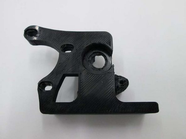 Place the printer extruder washer into the extruder body