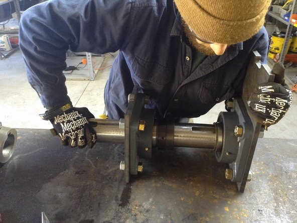 Feed shaft through bearings and lock colars