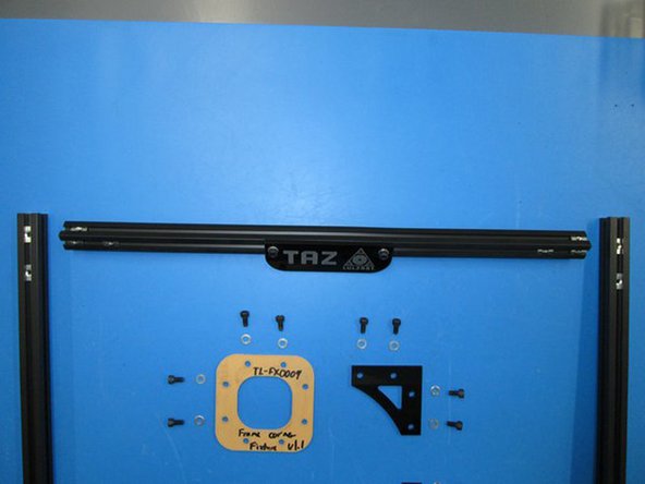 There is a tapped extension at the top of both the right and left extrusions.