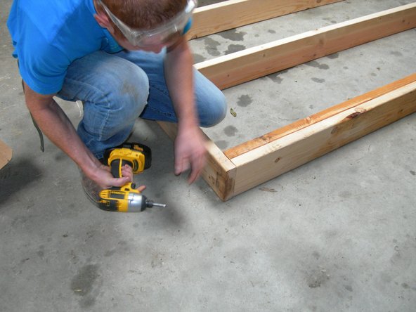 Lay your two longer pieces with the layout marks on them facing each other and lay your 6 shorter pieces in between, roughly in the position of the marks.